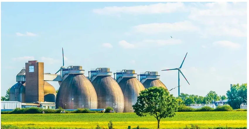 Anaerobic digesters and a wind turbine at a sludge treatment works