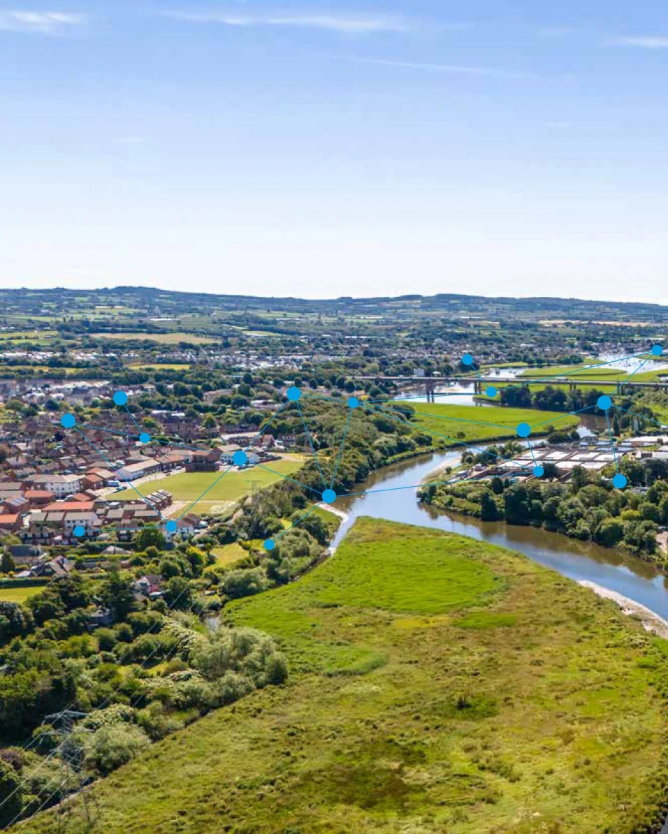 Digital business twin network overlaid on an aerial view of a UK river catchment